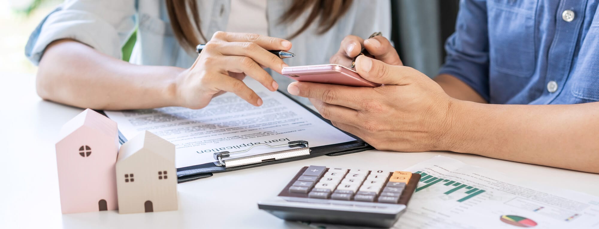 Two people calculating for credit payments