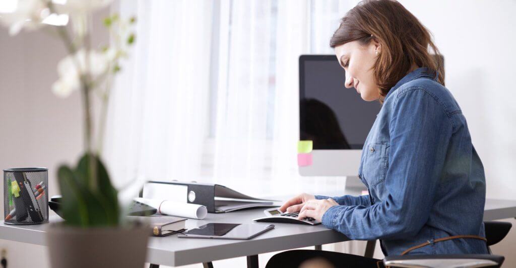 Woman working on her desk